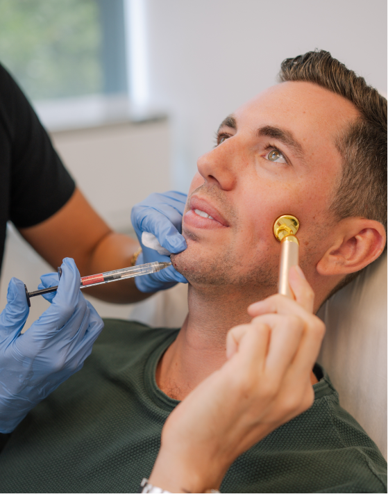 Man receiving a cosmetic treatment with a roller Dermal Fillers injection