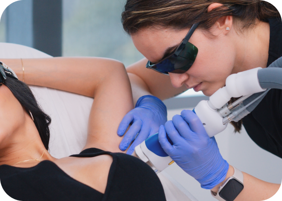 Women getting underarm hair removal treatment